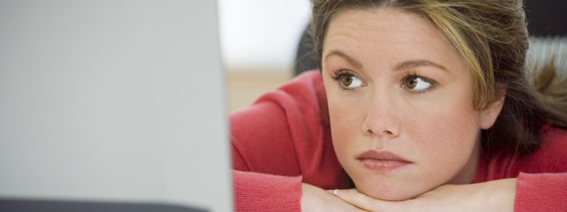Woman sad at computer